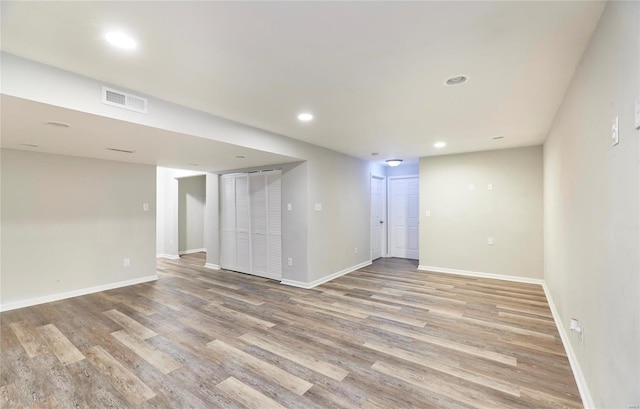 empty room with light hardwood / wood-style flooring