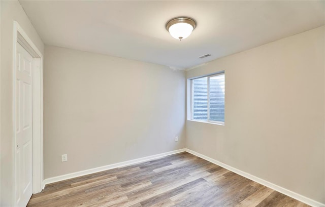 unfurnished bedroom with wood-type flooring