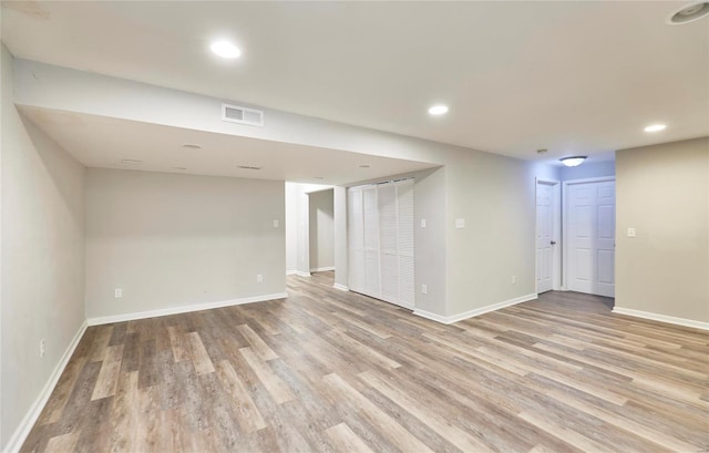 basement featuring light hardwood / wood-style flooring