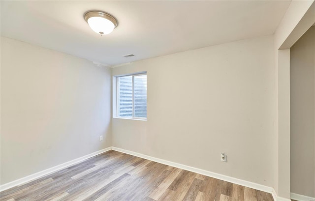 unfurnished room with light hardwood / wood-style flooring