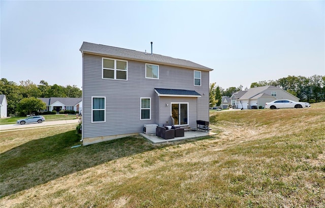 back of property with an outdoor hangout area, a patio area, and a lawn