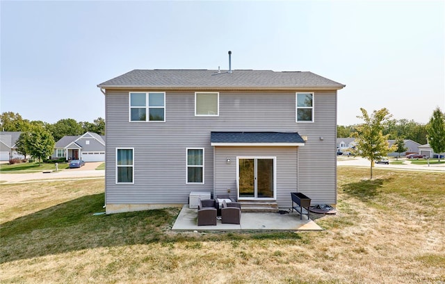 rear view of house with a patio area, a yard, and outdoor lounge area