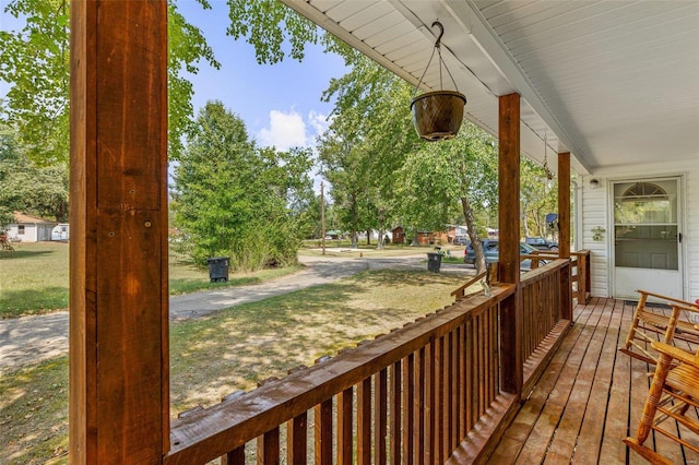 wooden terrace featuring covered porch