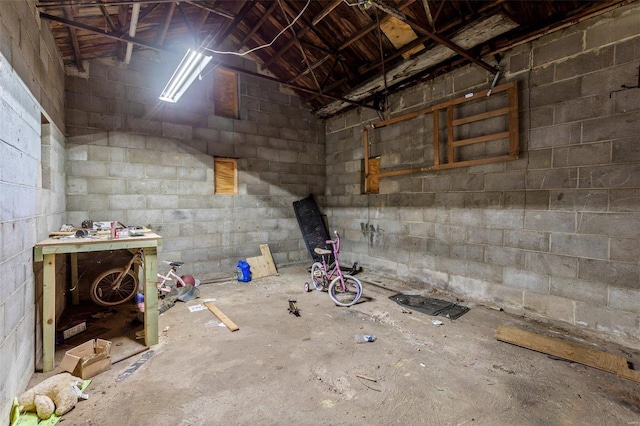 below grade area with concrete block wall