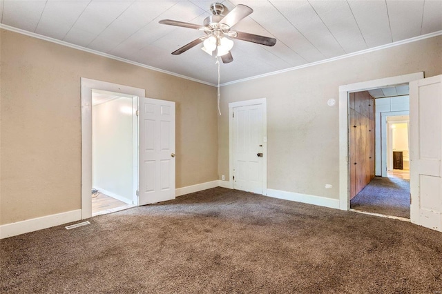 unfurnished bedroom featuring dark carpet, ceiling fan, and ornamental molding