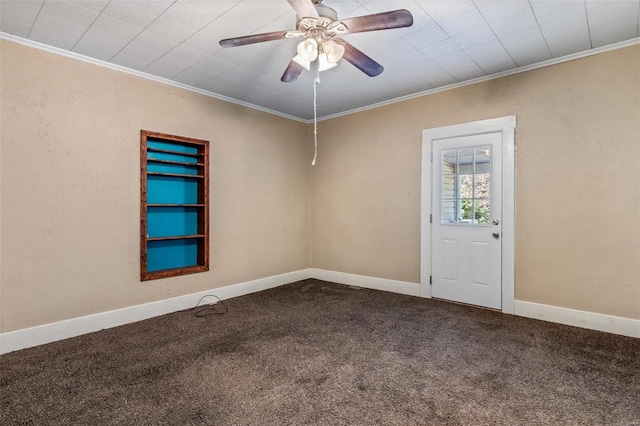 empty room featuring ornamental molding, ceiling fan, and carpet