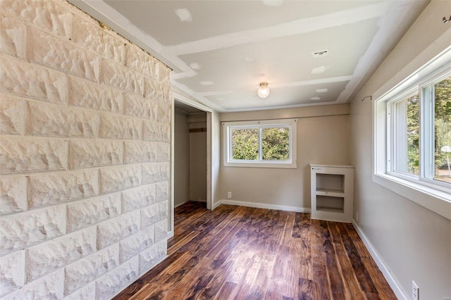 spare room with dark hardwood / wood-style floors