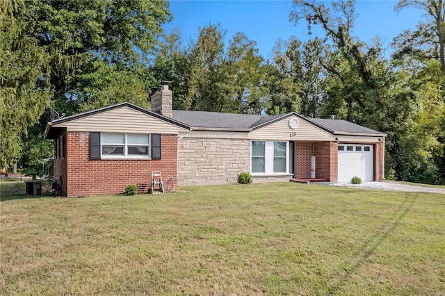 single story home with a garage and a front lawn