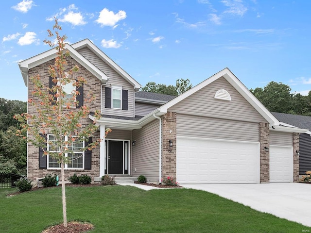 view of front facade featuring a garage and a front yard