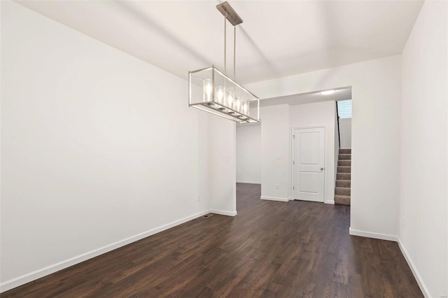 unfurnished dining area with dark hardwood / wood-style floors