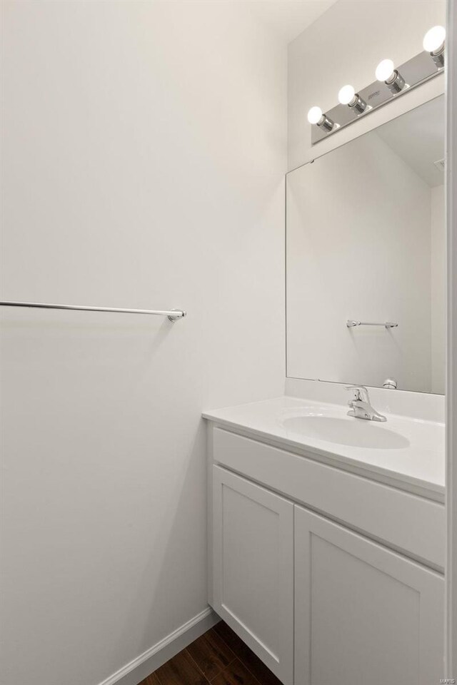 bathroom featuring hardwood / wood-style floors and vanity