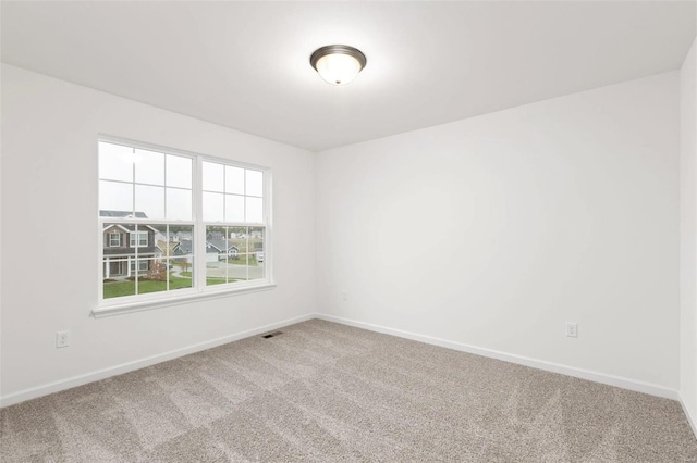 unfurnished room with carpet floors