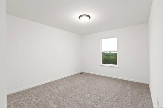 spare room with carpet floors