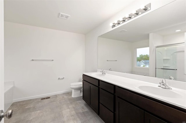 full bathroom featuring toilet, shower with separate bathtub, and vanity