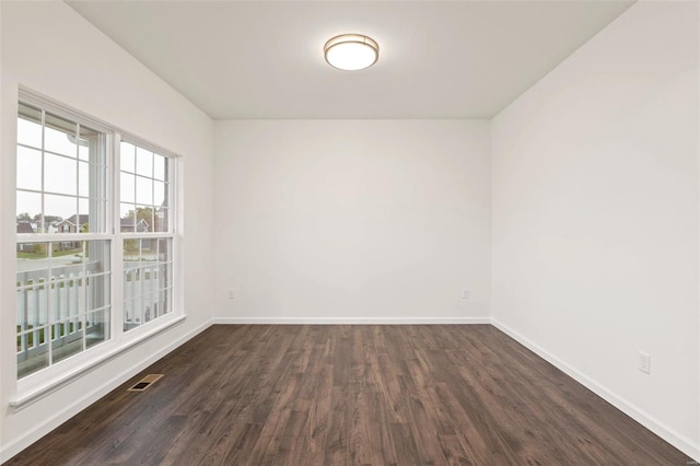 empty room featuring dark hardwood / wood-style floors