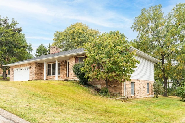 view of front of property featuring a garage and a front yard