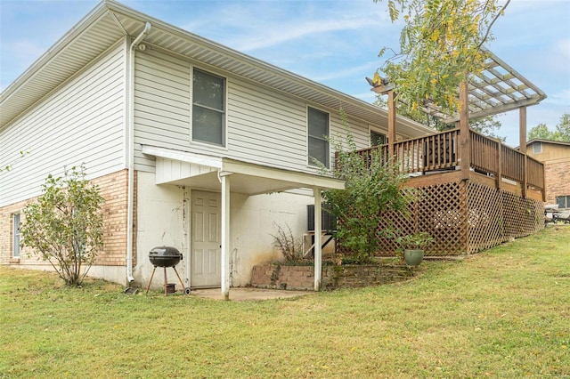 back of property featuring a pergola, a lawn, a wooden deck, and cooling unit