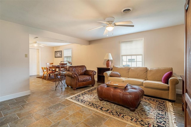 living room with ceiling fan