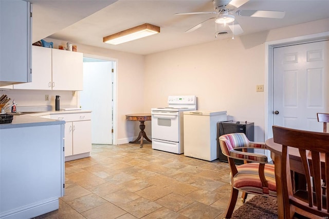 kitchen with white cabinets, sink, ceiling fan, and white electric stove