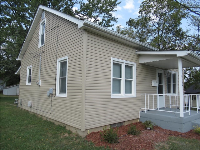 view of property exterior with a lawn