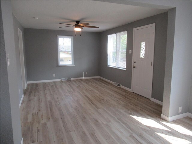 foyer entrance featuring light hardwood / wood-style floors and ceiling fan