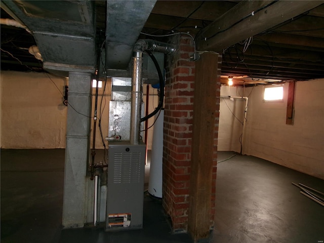 basement featuring gas water heater