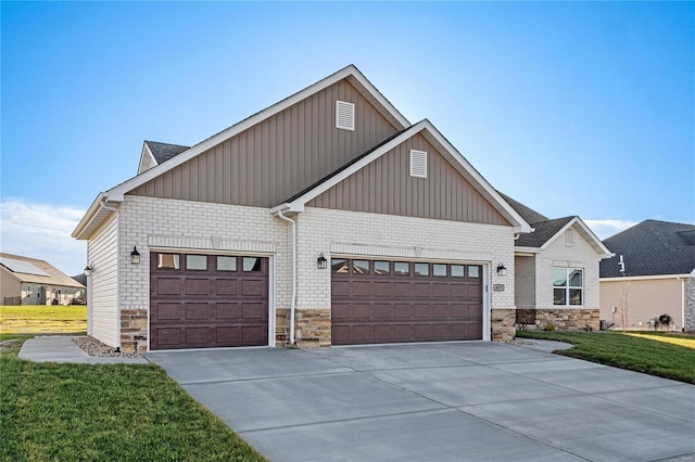 view of front of home featuring a garage and a front lawn