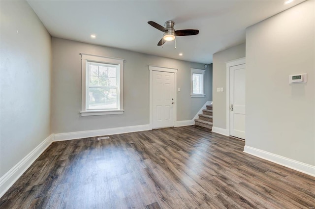 spare room with ceiling fan and dark hardwood / wood-style floors