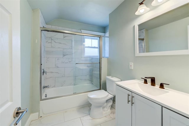 full bathroom featuring enclosed tub / shower combo, toilet, and vanity