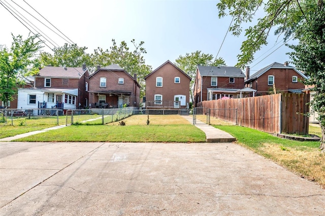 rear view of house with a yard