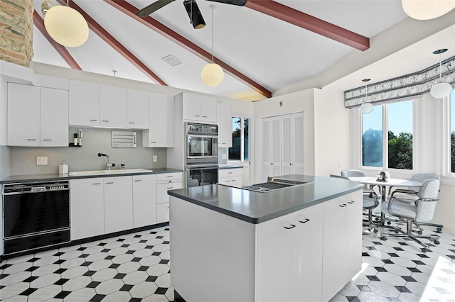 kitchen featuring pendant lighting, beamed ceiling, white cabinetry, sink, and black appliances