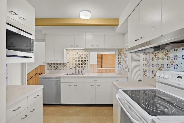 kitchen featuring white cabinetry, stainless steel appliances, sink, and decorative backsplash