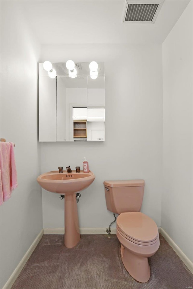 bathroom with sink and toilet