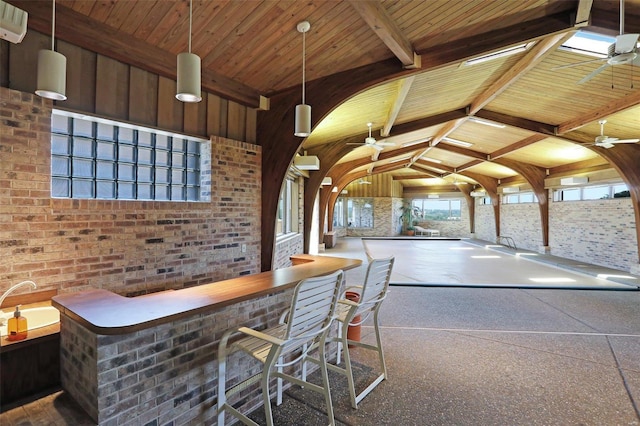 interior space with wood ceiling, ceiling fan, hanging light fixtures, high vaulted ceiling, and beamed ceiling