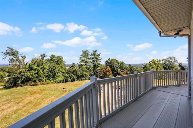 wooden deck with a lawn