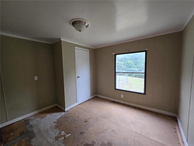 spare room featuring crown molding