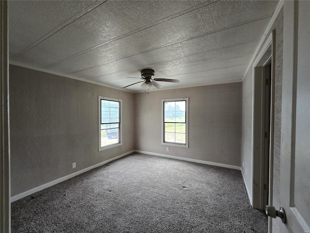 spare room featuring carpet floors, a textured ceiling, and ceiling fan