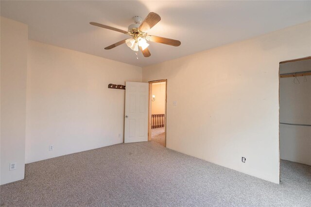 spare room with carpet flooring and ceiling fan