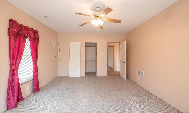 unfurnished bedroom featuring carpet flooring and ceiling fan