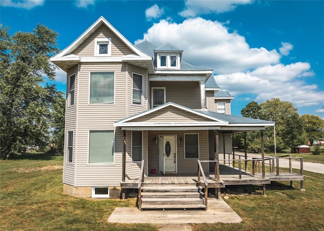 view of front facade with a front lawn and a porch