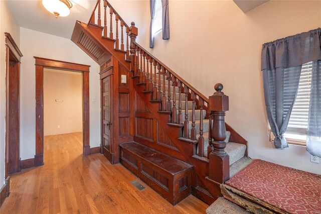 stairs featuring hardwood / wood-style flooring