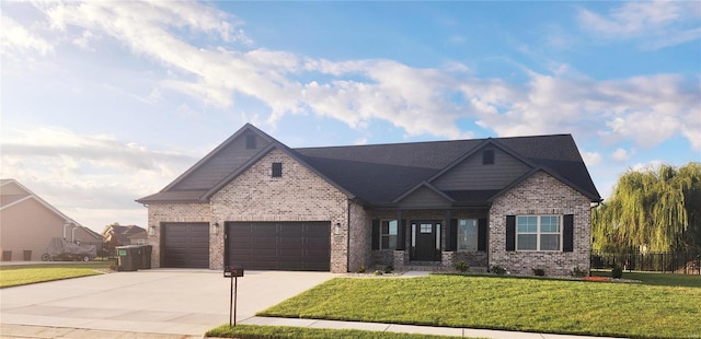 craftsman-style house featuring a front yard and a garage