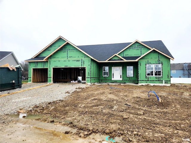 property in mid-construction with a garage