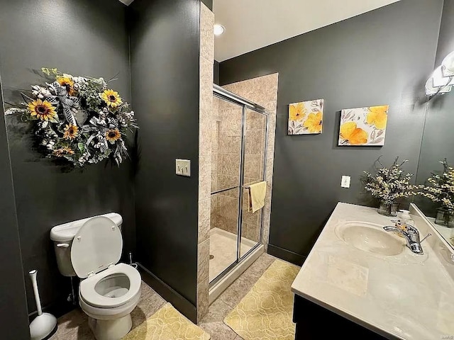 bathroom featuring vanity, toilet, and walk in shower