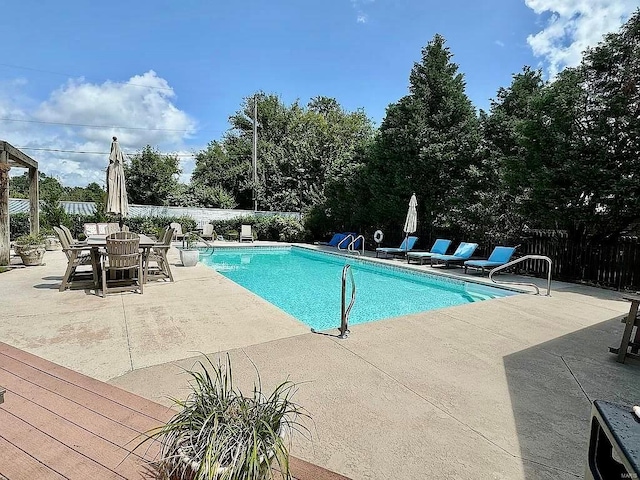 view of swimming pool with a patio area