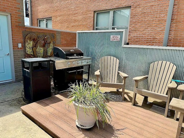 view of patio / terrace featuring a grill and a deck