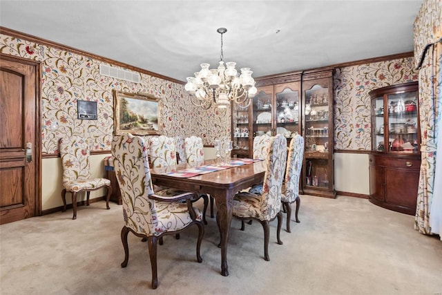 carpeted dining space featuring crown molding and a notable chandelier