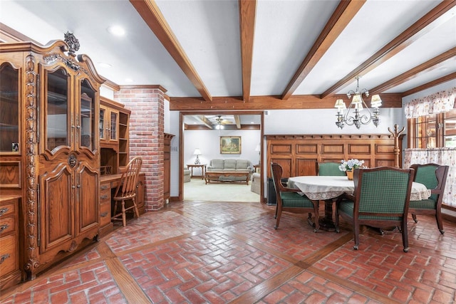 dining space with beam ceiling and a chandelier