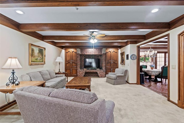 living room with ceiling fan with notable chandelier, beam ceiling, and light colored carpet