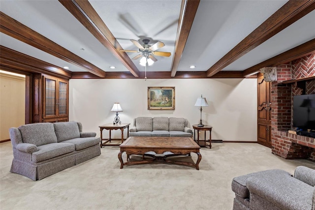 carpeted living room featuring ceiling fan and beam ceiling